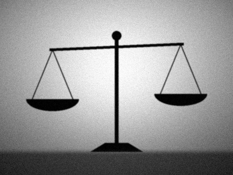 Silhouette d'une balance de la justice sur fond clair, noir et blanc
