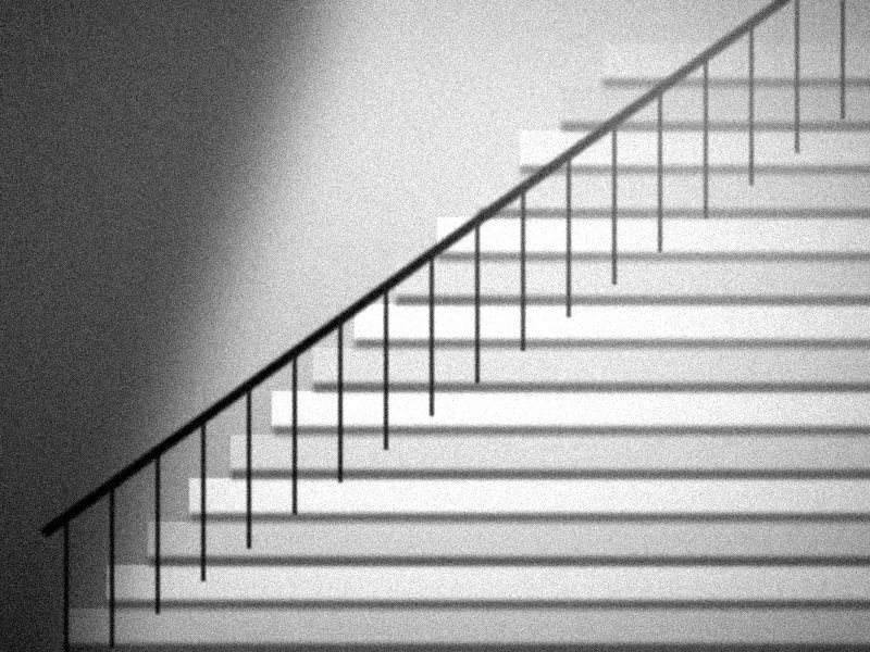 Escalier de pierre baigné de lumière avec une rampe en fer forgé, noir et blanc